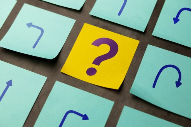 Economic,Uncertainty,Symbolized,By,Arrows,And,A,Question,Mark,,Reflecting